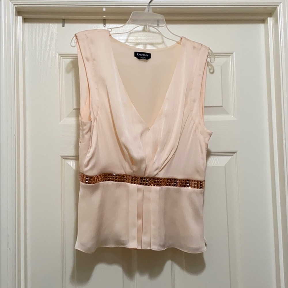 Bebe peach peplum sleeveless blouse